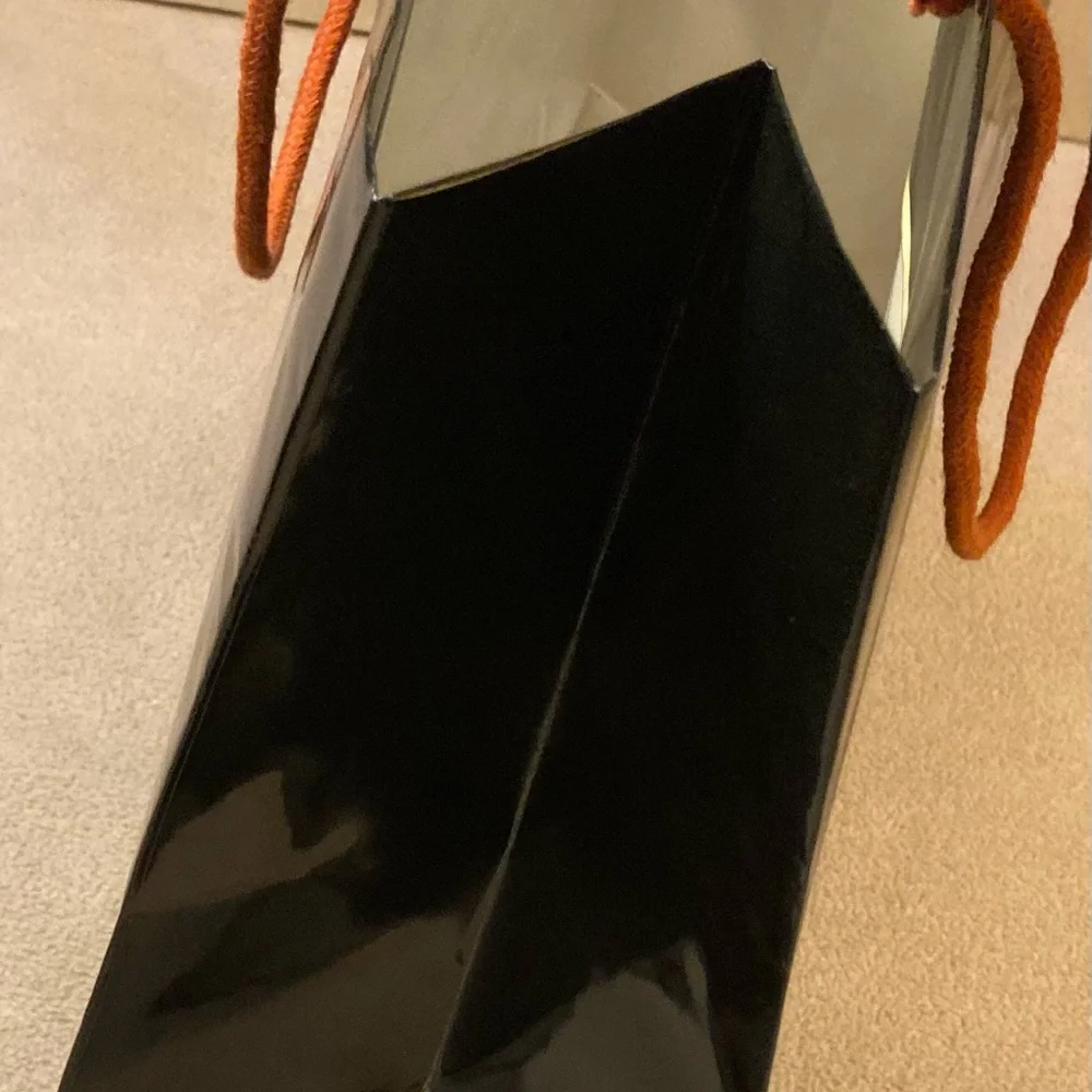 Guy Laroche Paris,black gloss glazed paper branded shopping tote,orange handles